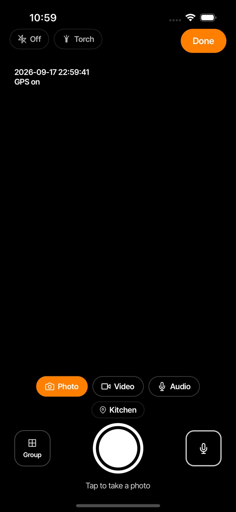 The camera screen controls: flash, torch, mode pills, room chip, Group, shutter